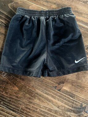 Boys Nike black shorts. Size 2T used good condition. No tips or stains.